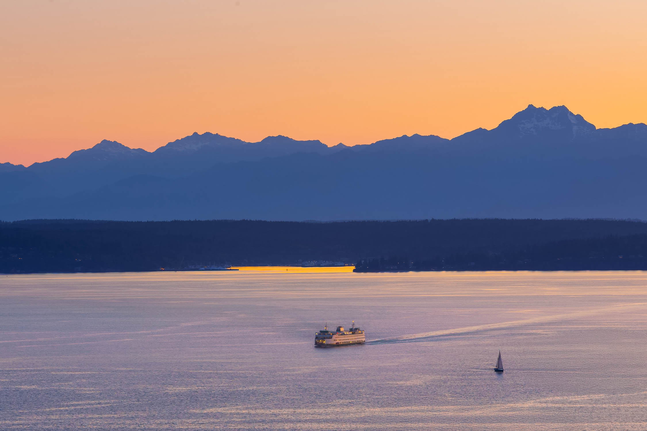 Western sunset over Elliott Bay with the Olympic range on the horizon